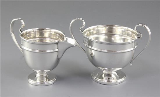 A George V silver sugar pedestal bowl and cream jug, by Viners Ltd, jug height 103mm, weight 9.7oz/303grms.